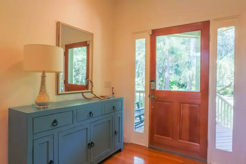 Inside the front door you'll find this foyer with hardwood floors and high ceilings.