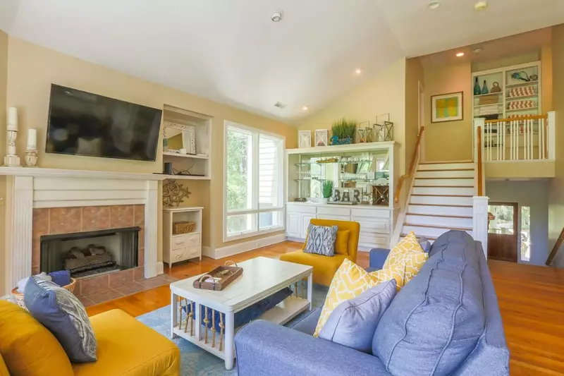 From the foyer, you'll walk up a half flight of stairs to find this comfortable living room.