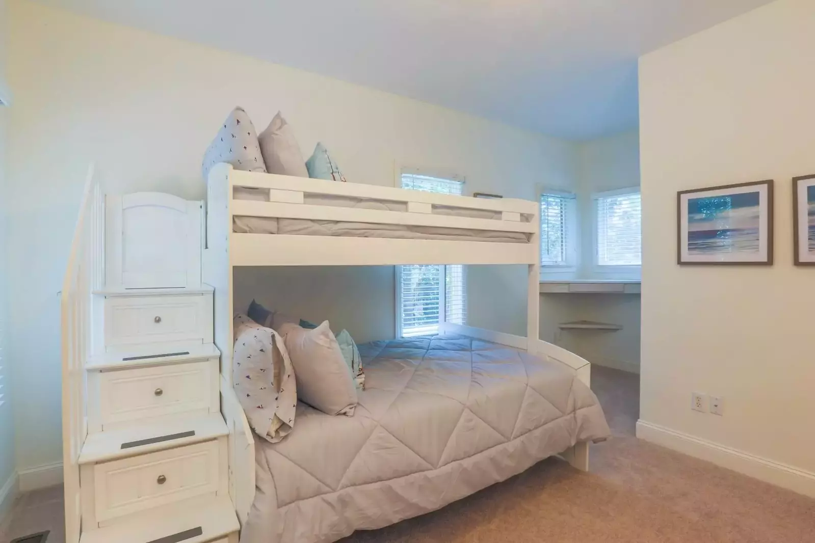 This bedroom with a full bed, twin bed and trundled twin is located on the home's lower level.