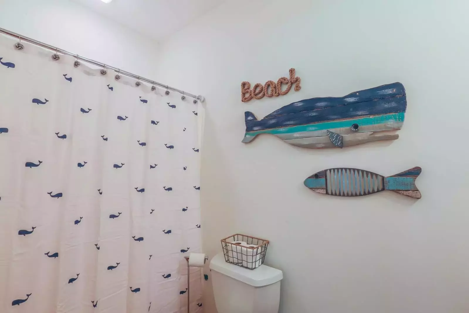 This fish themed bathroom also has a shower.