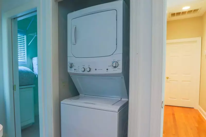 There is a stackable washing machine & dryer available for your use.