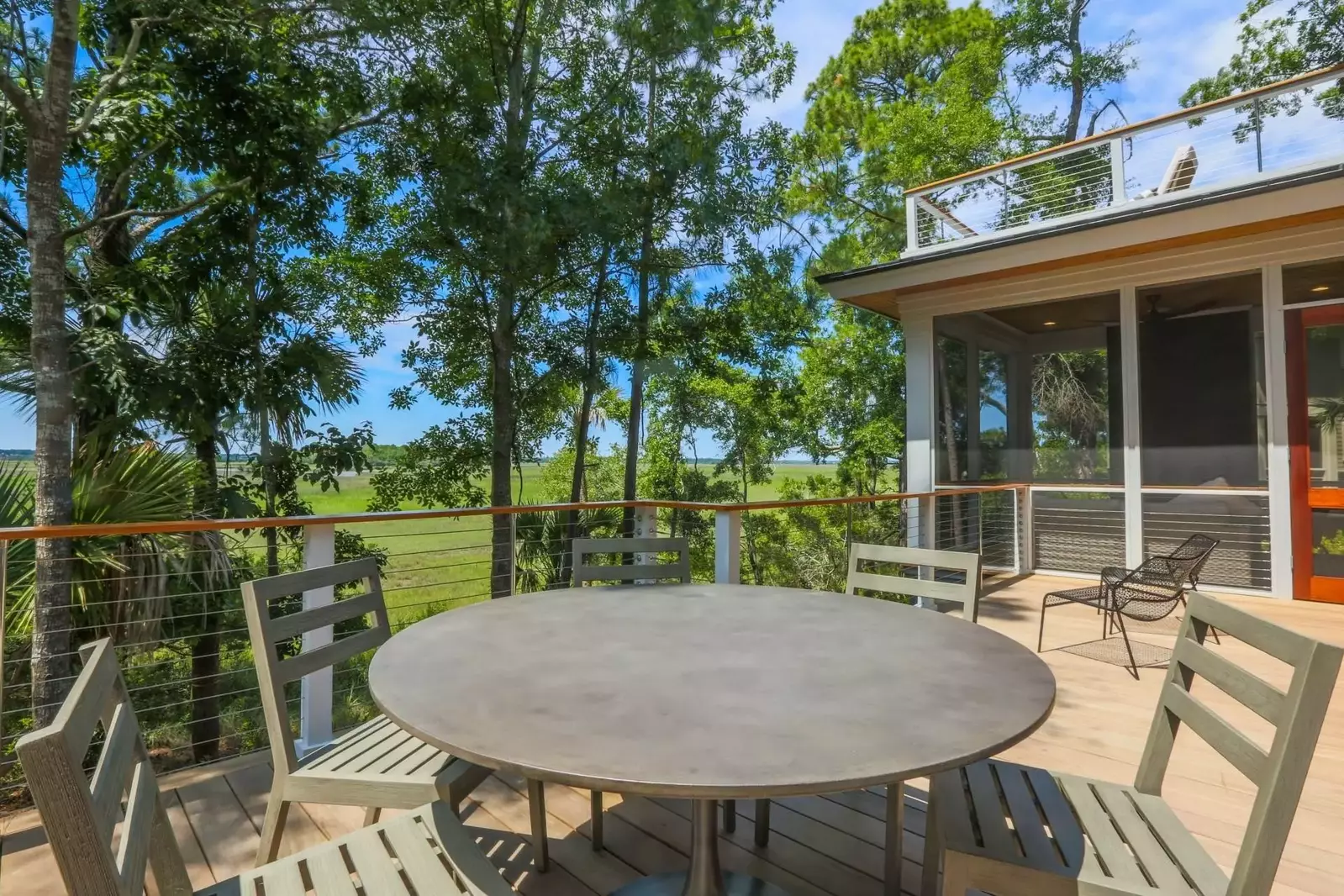 Between the multi-level back decks and screened porch, this house features an incredible amount of outdoor space.