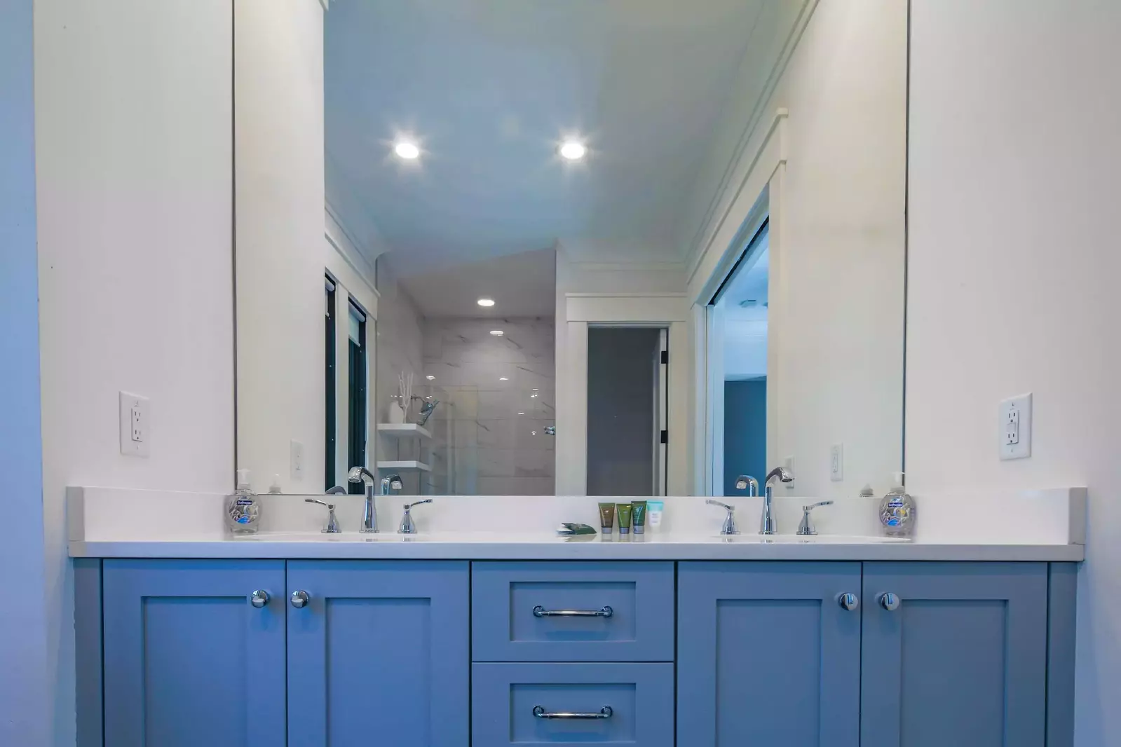 The vanity in the primary bathroom has two sinks and plenty of storage space for your personal belongings.