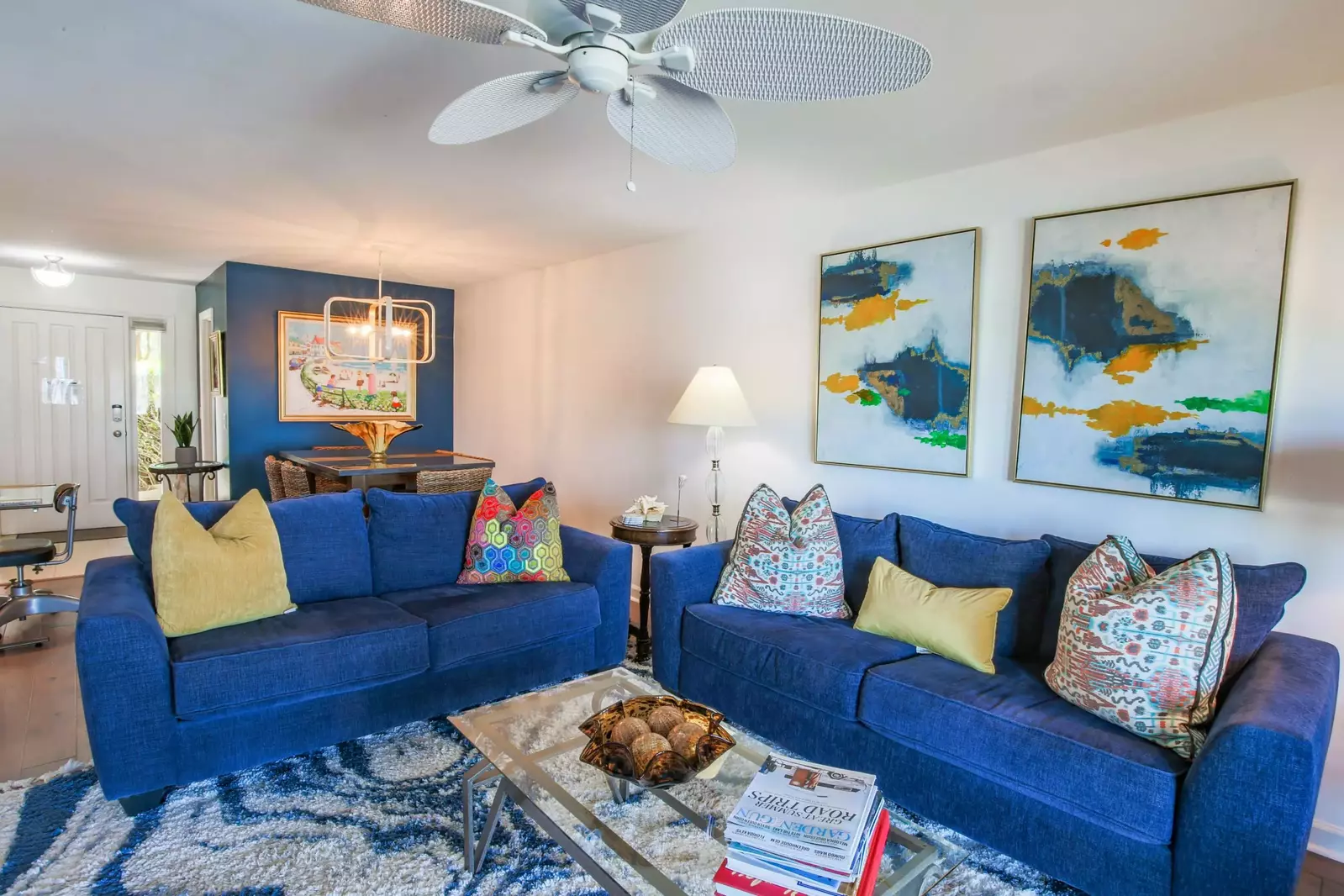 One of the two sofas in the living room can be converted into a queen bed.