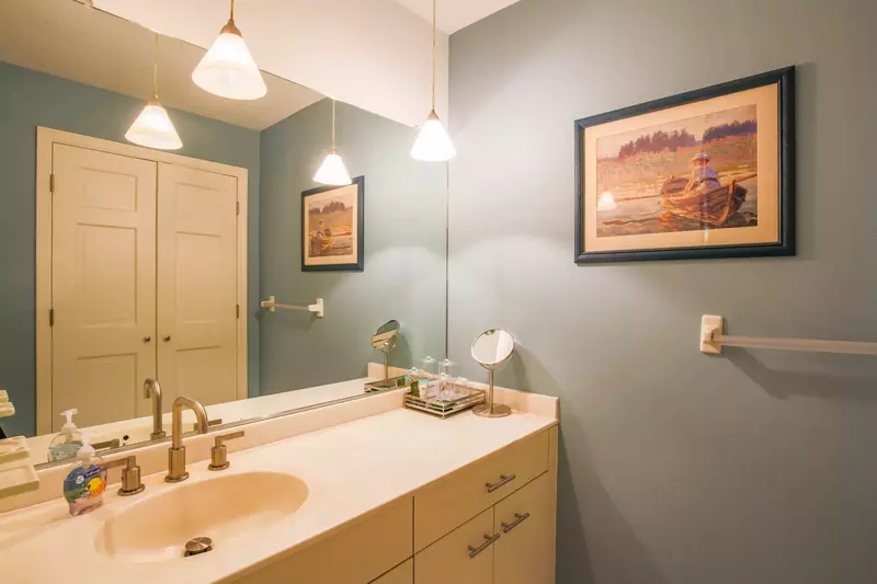The bedroom suite also features a large bathroom with a spacious vanity.