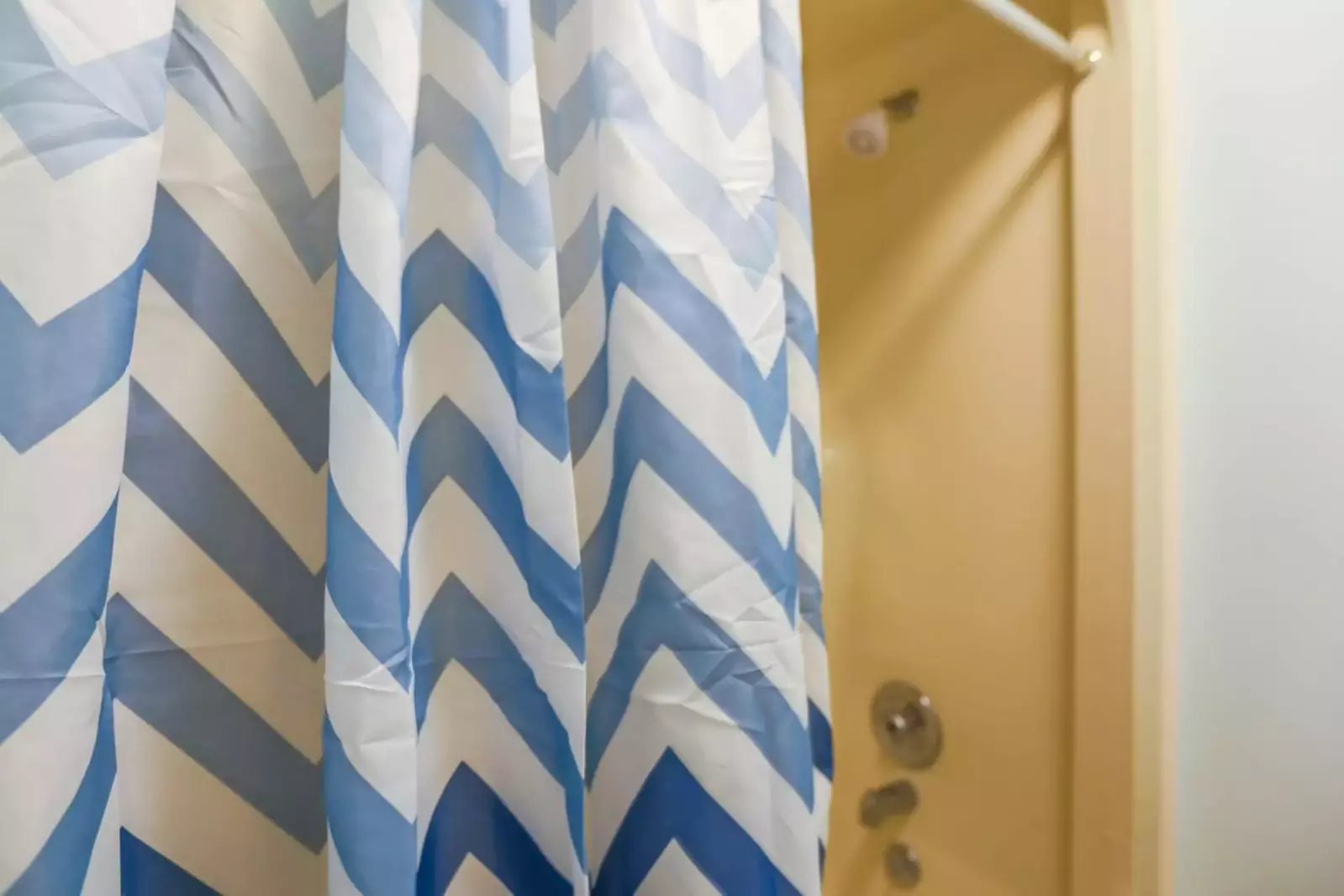The en suite bathroom has a shower/tub combo.
