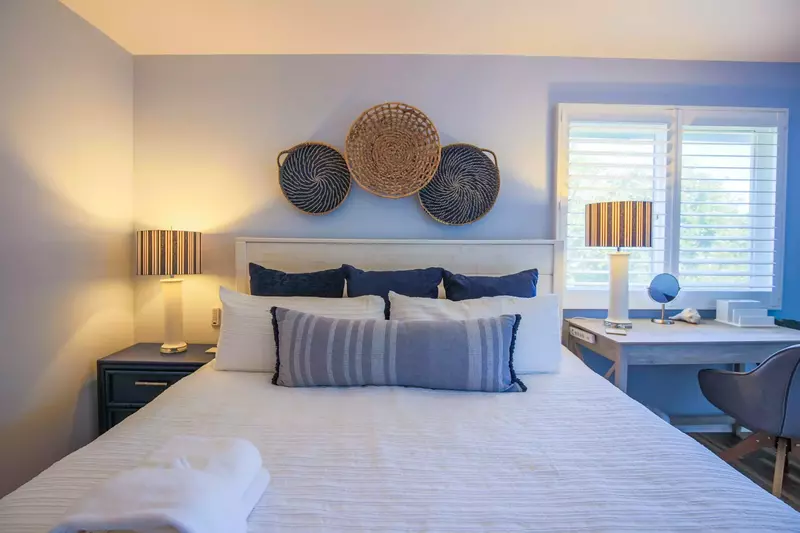 The serene bedroom features a king bed with freshly laundered linens.