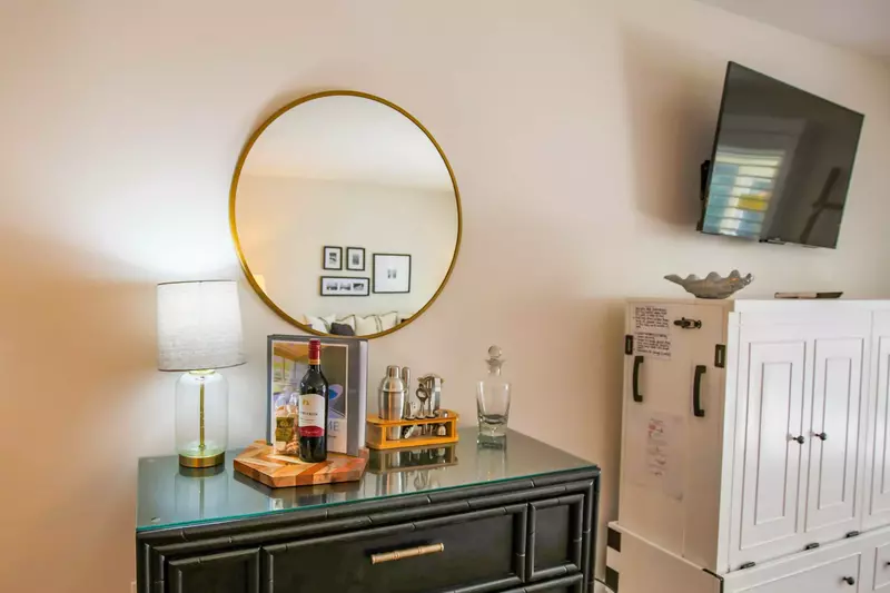 There is also a small bar area near the dining room and living room areas.