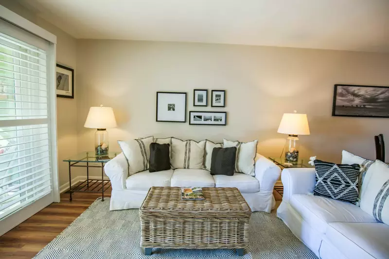 The living room features two comfortable sofas.