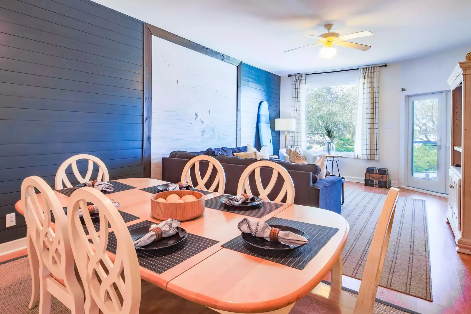 The dining table comfortably seats 6 people and there are 2 additional stools at the kitchen island.