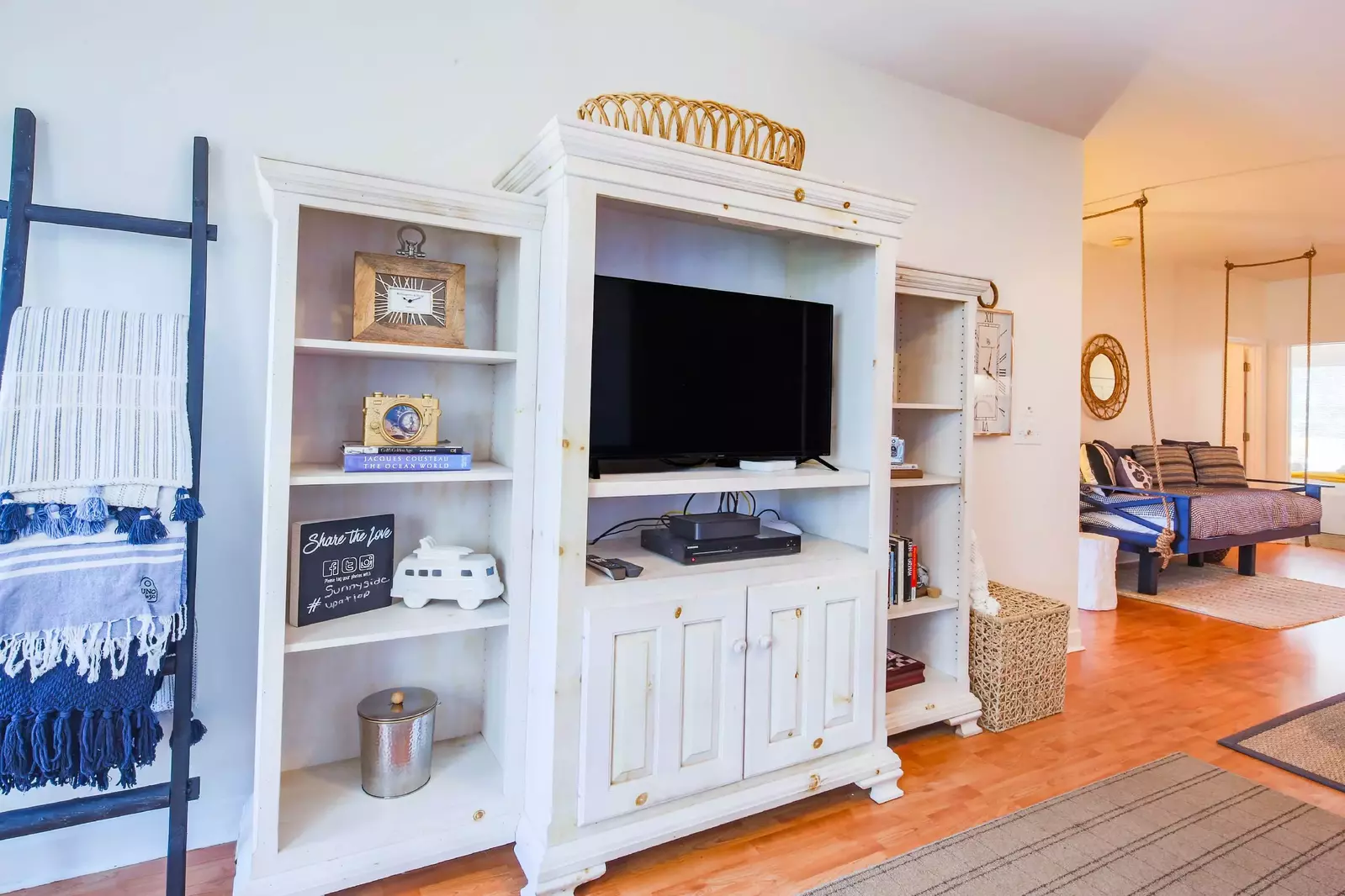 The living room also has a large screen TV.