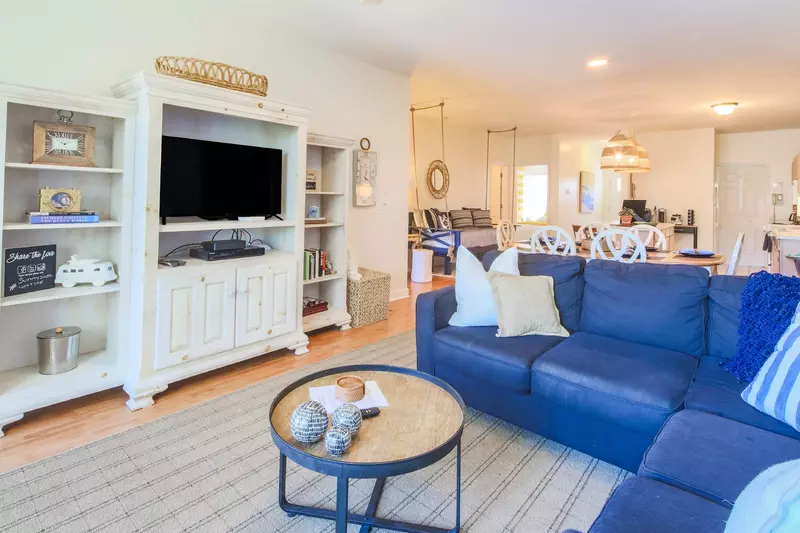 The living room flows into the dining area and kitchen.