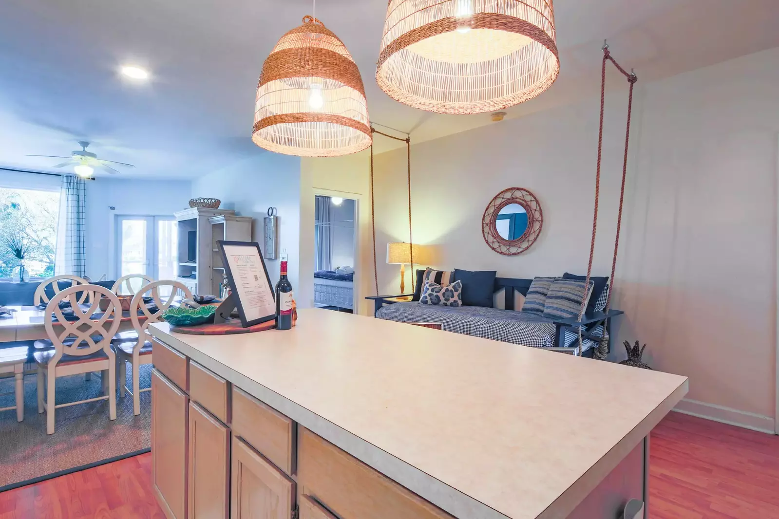 The swing bed near the kitchen separates the two bedrooms.