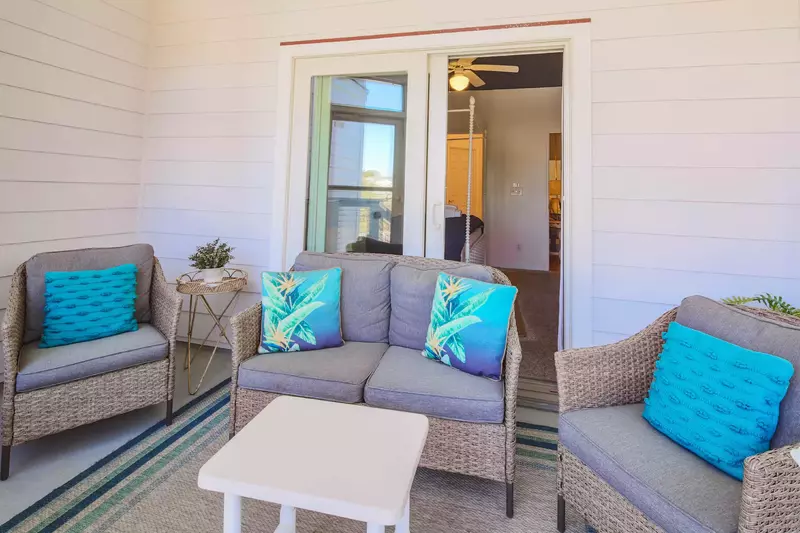 Step out onto the screened porch from the master suite and you'll find this seating area.