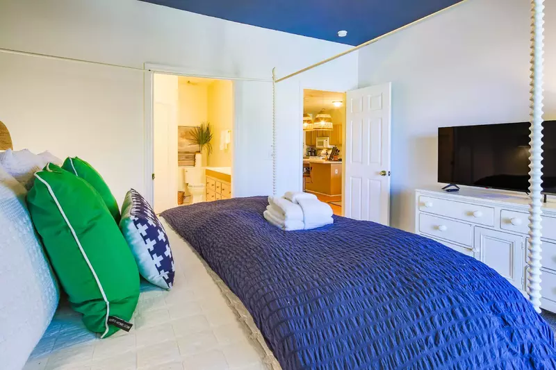 The master bedroom has an en suite bathroom through the door on the left in this photo.