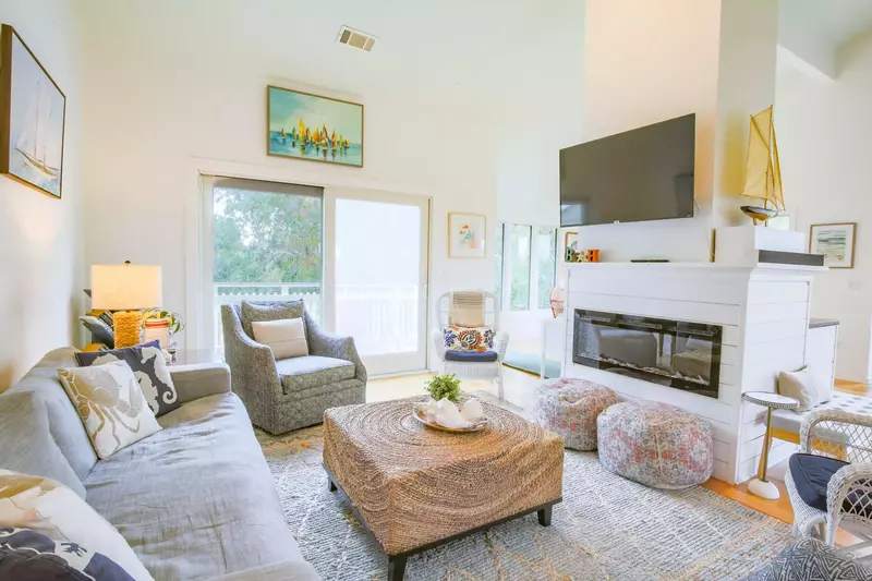 The electric fireplace separates the living room from the dining area.