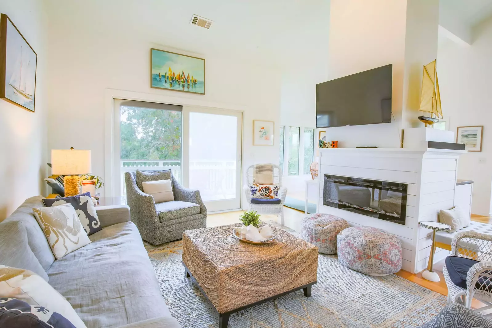The electric fireplace separates the living room from the dining area.