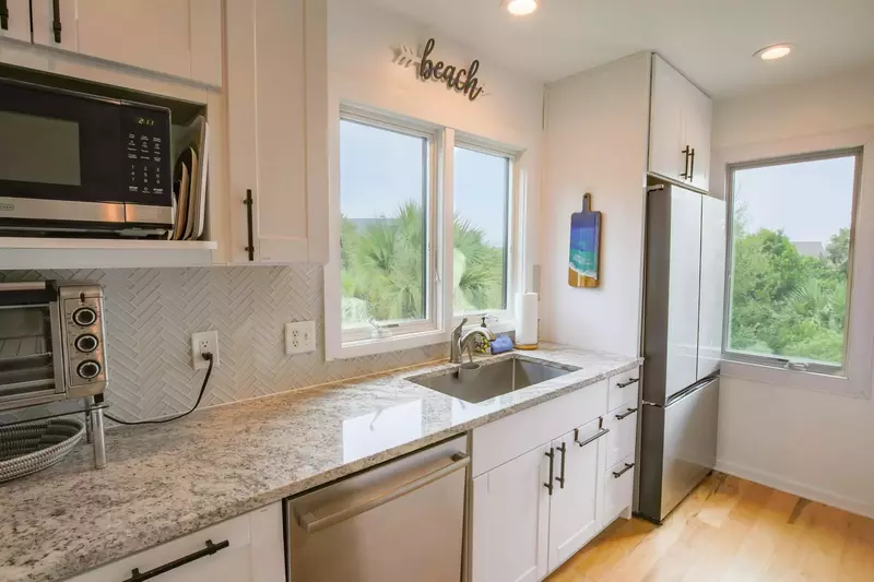 The kitchen has a refrigerator, dishwasher, microwave, toaster oven and more.