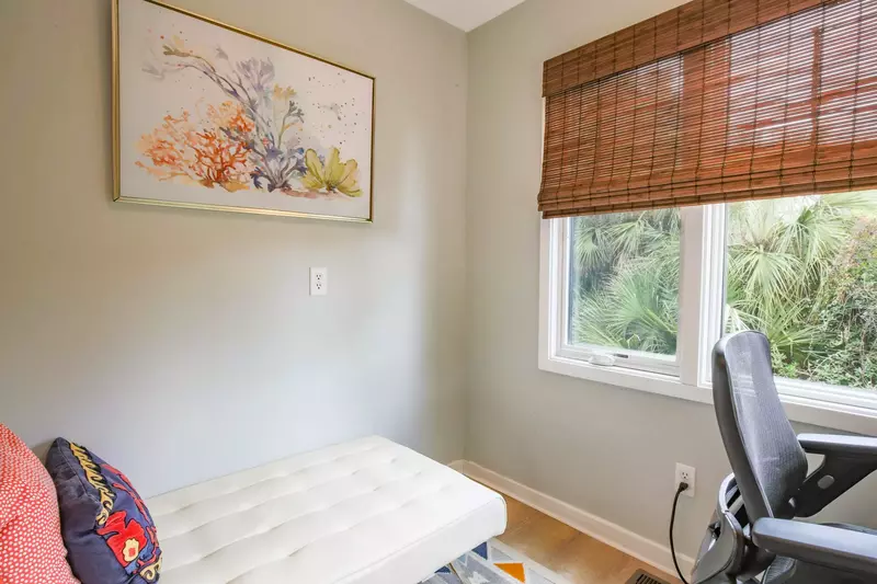 The office features a desk and a futon that can be converted into a twin bed.