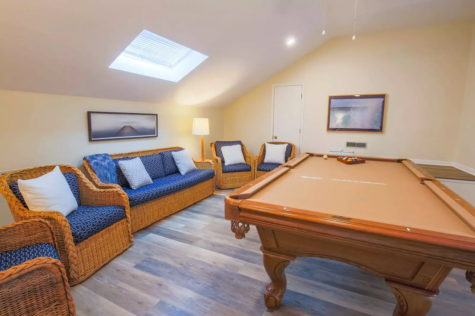 The loft features a full size pool table, a sky light and a seating area.