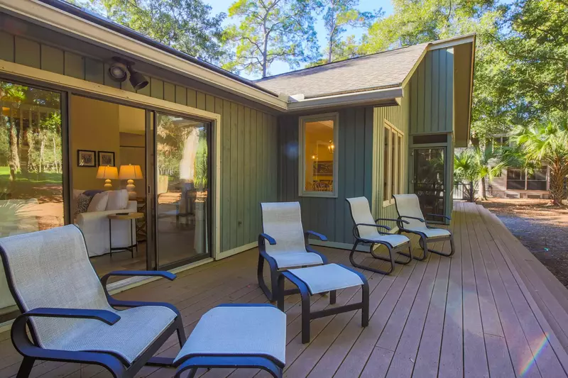 The back porch extends along the full length of the golf course side of the home.
