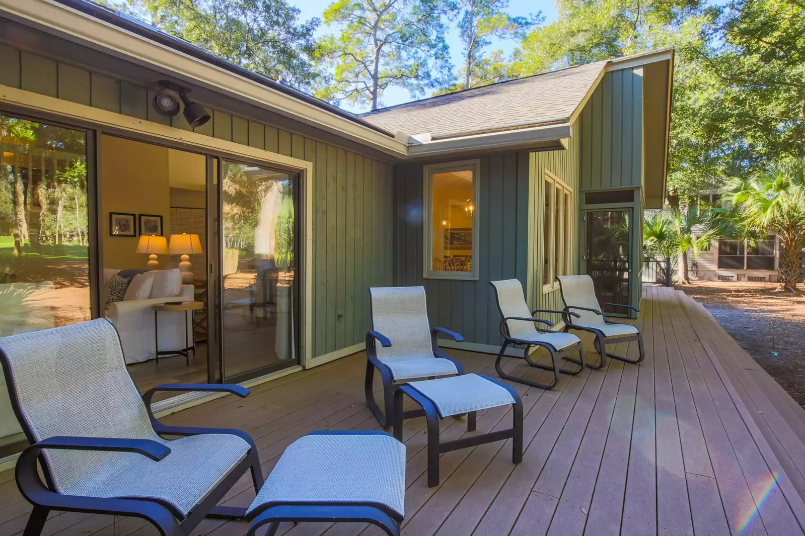 The back porch extends along the full length of the golf course side of the home.