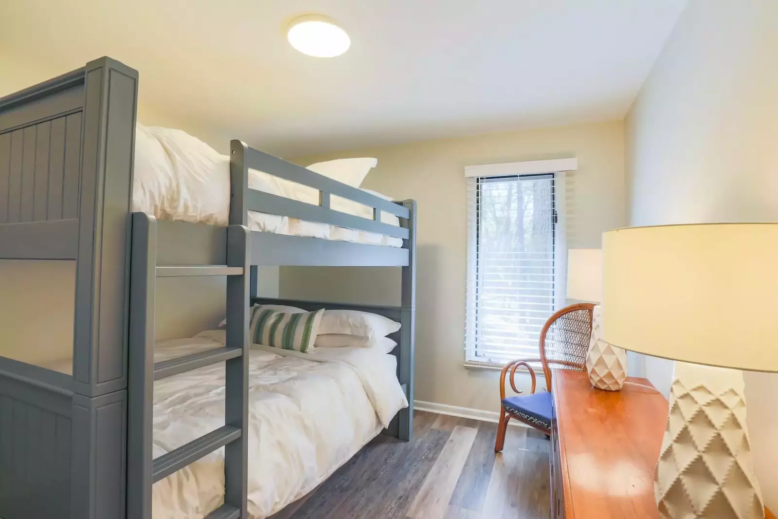 The third bedroom features queen bunk beds.