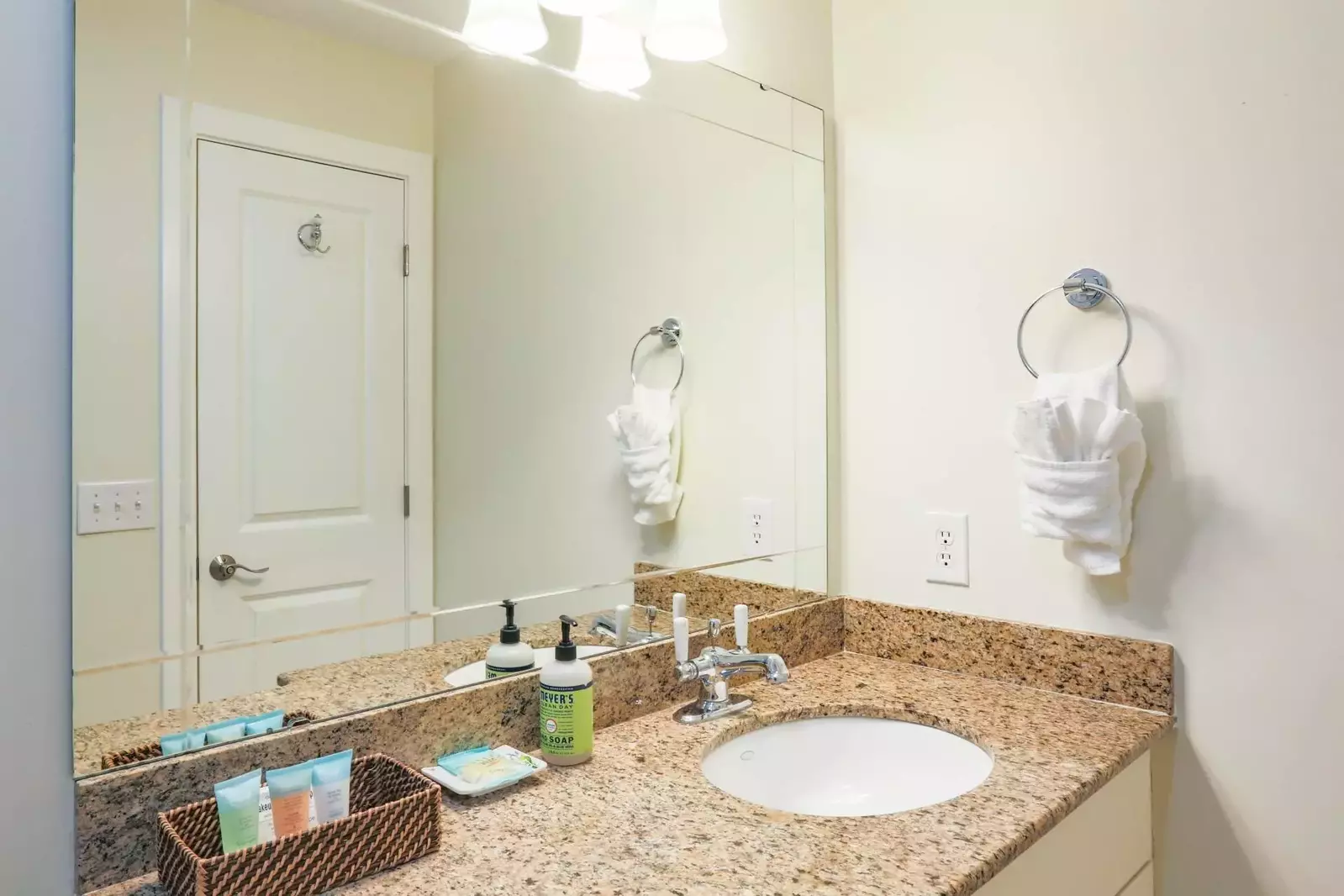 The hallway bathroom has a spacious vanity.