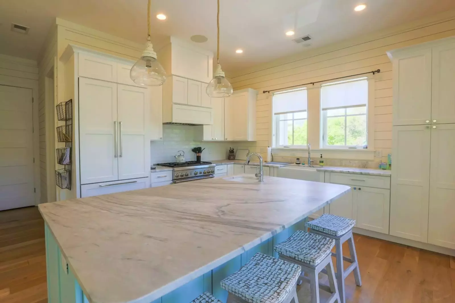 The gorgeous kitchen has a Thermador six-burner pro gas range and custom built-in Thermador refrigerator.