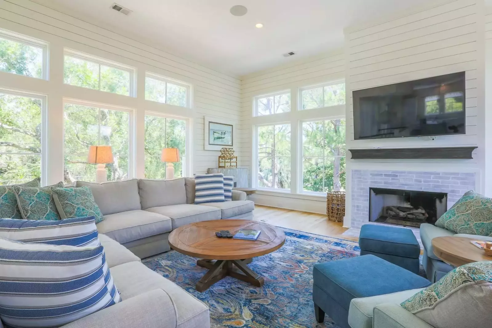 The living room receives terrific natural light through its nearly floor-to-ceiling windows.