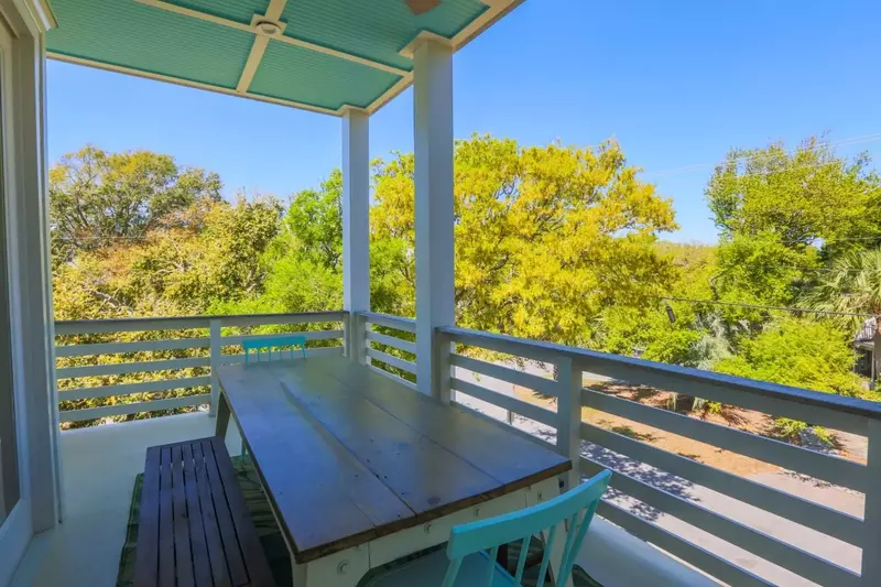 This outdoor dining area is located off the kitchen on the covered balcony.