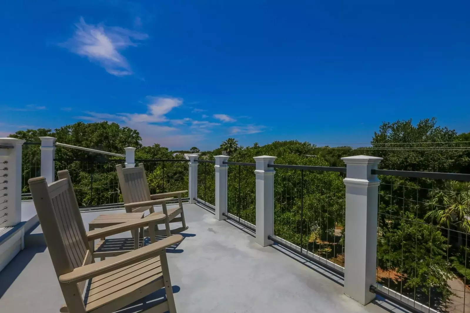 The roof deck also has this seating area with two rocking chairs and a table.