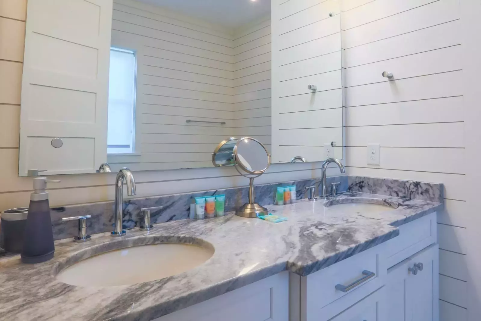 The en suite bathroom for the master suite has a spacious vanity with his & her sinks.