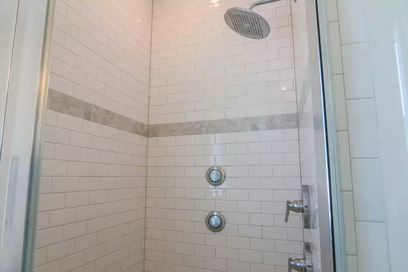 There's also a walk-in shower with a rain shower head in the en suite bath for the master suite.