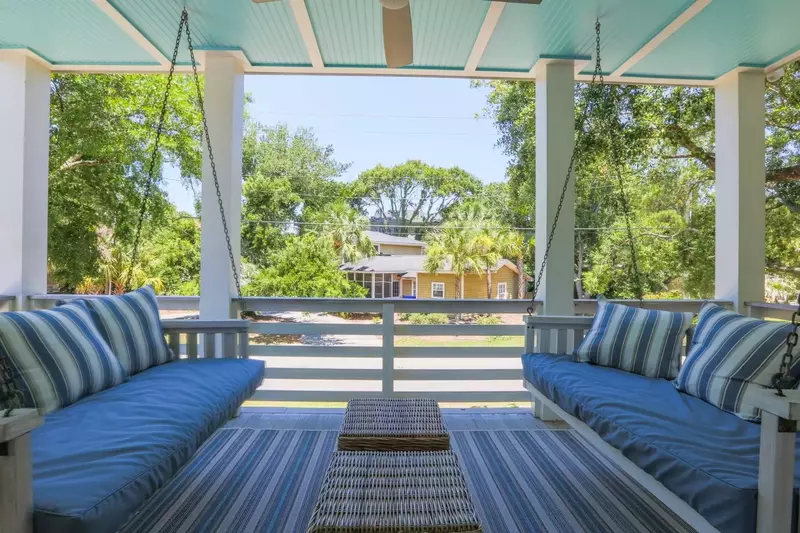 The covered porch off of the lower level master suite has two swing beds.