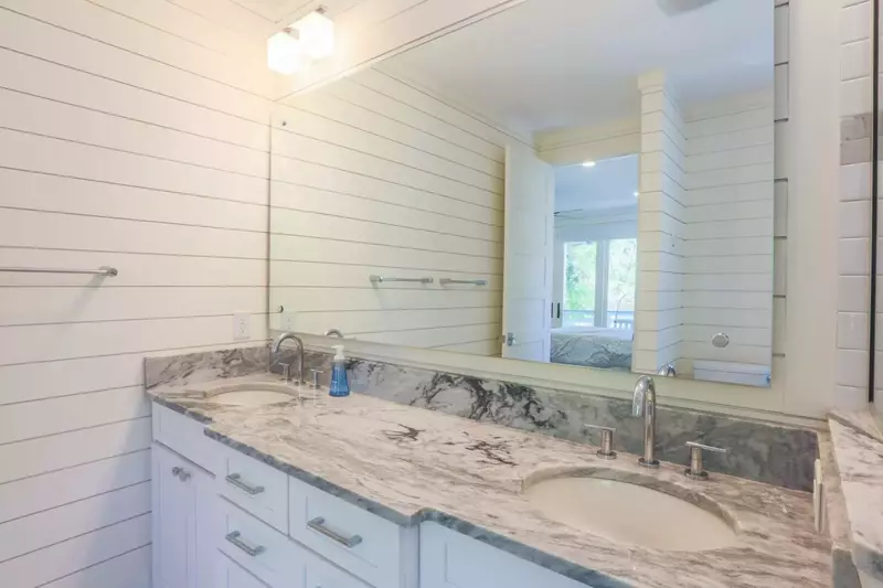 The ground floor master suite also a beautiful double-sink vanity.