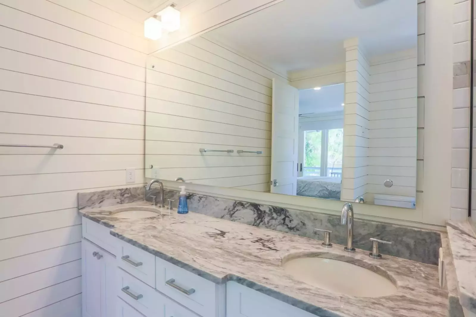 The ground floor master suite also a beautiful double-sink vanity.