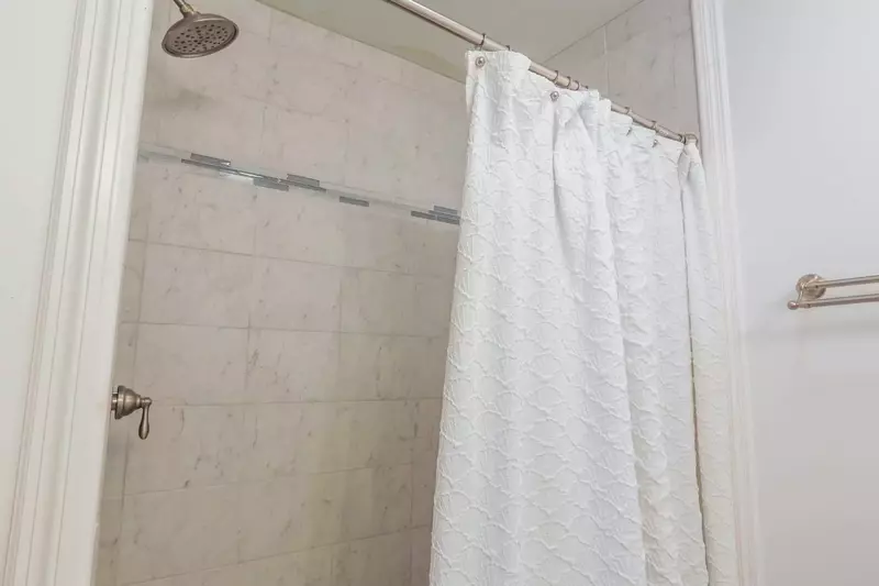 The ground floor bathroom also has a beautifully tiled walk-in shower.