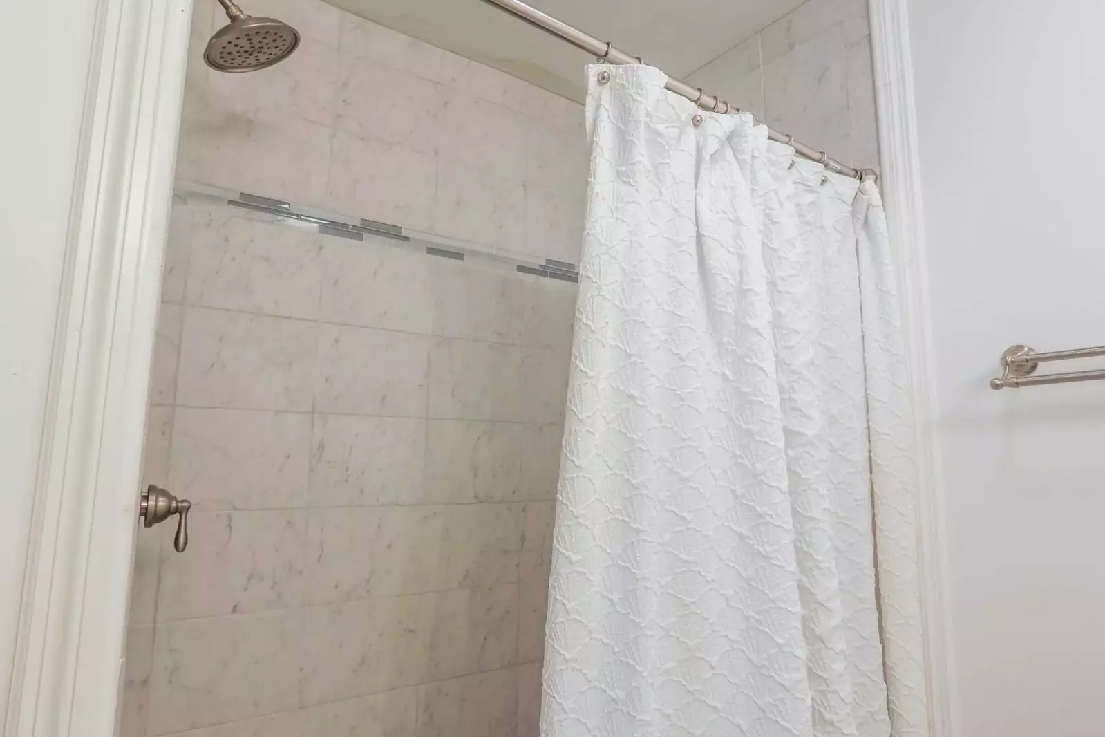 The ground floor bathroom also has a beautifully tiled walk-in shower.
