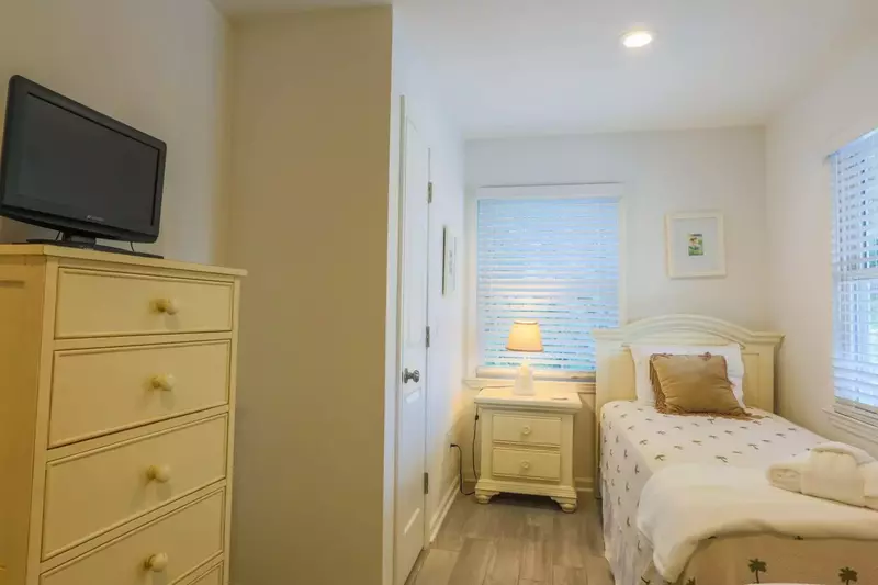 There is also a dresser and TV in the twin bedroom.