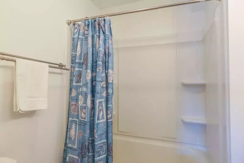 The upstairs bathroom also has a shower/tub combo.
