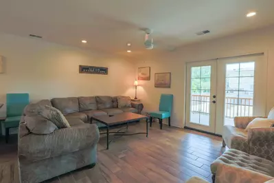 Carolina Breezes West features a large living room that opens onto the second floor covered porch.