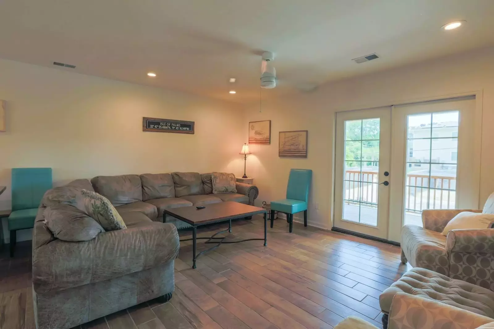 Carolina Breezes West features a large living room that opens onto the second floor covered porch.