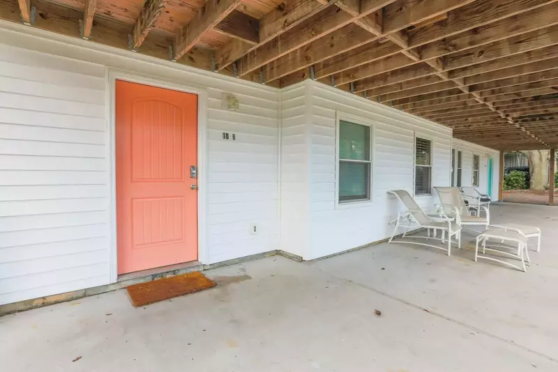 This orange door opens into Carolina Breezes West.