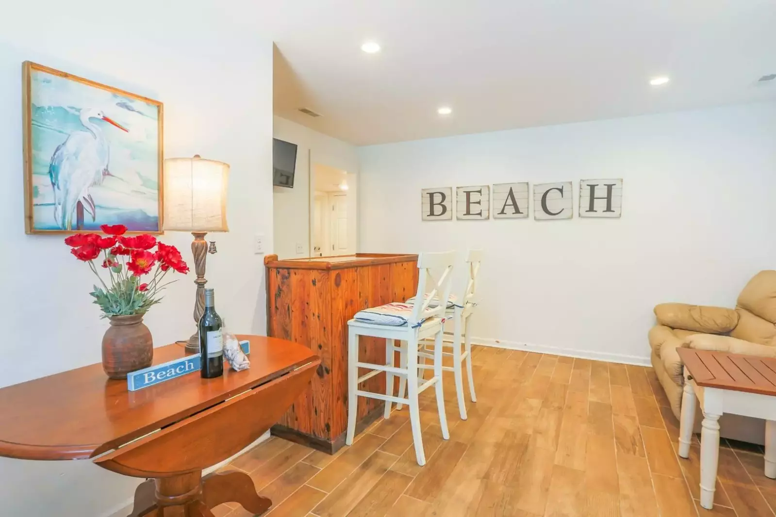When you enter the home, you'll find this tiled entryway, seating area and staircase to the second floor.