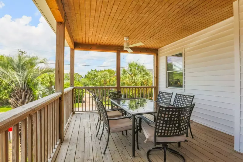 On the second floor covered porch, you'll find this dining table that seats 6.