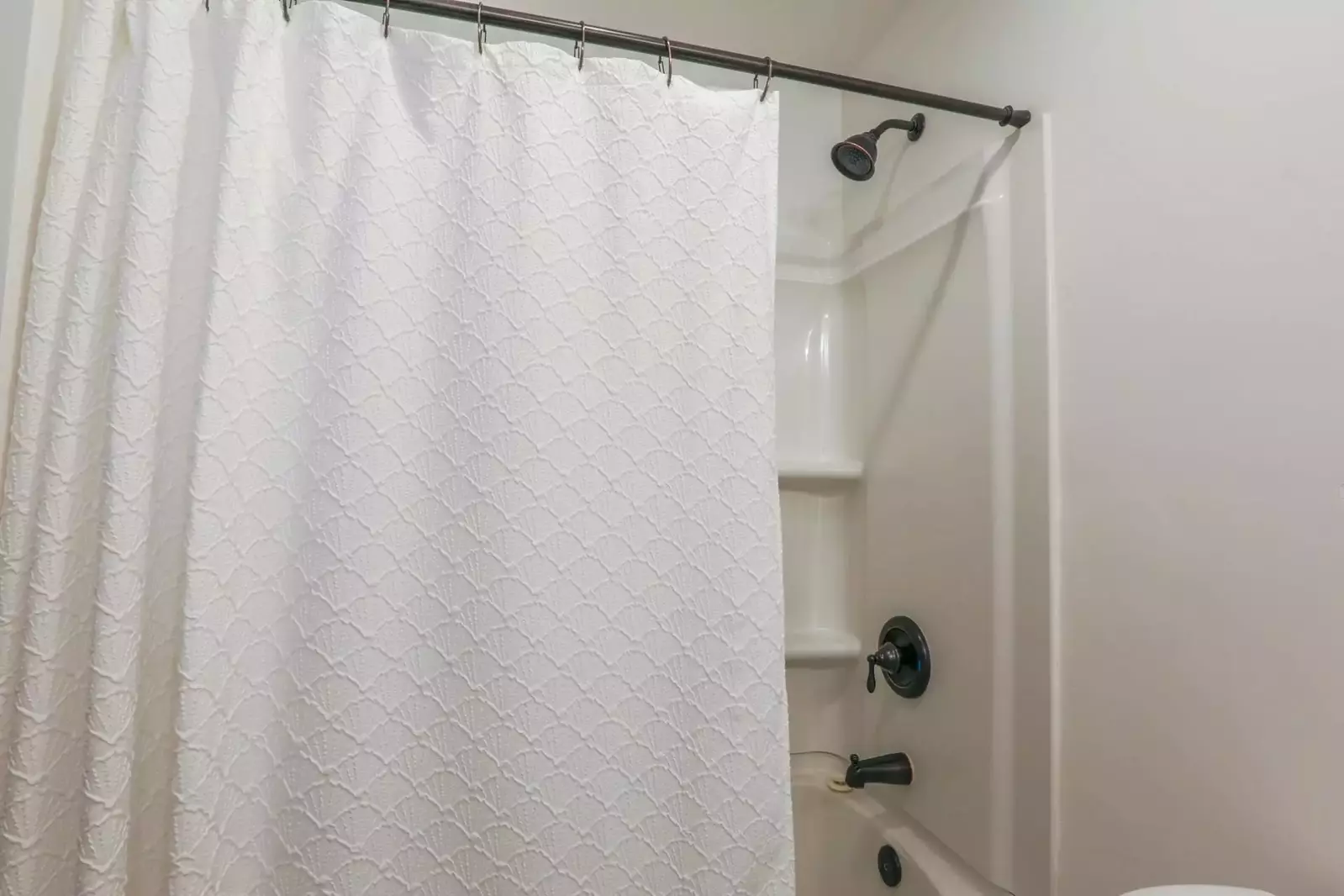 The first floor bathroom also has a shower/tub combo.