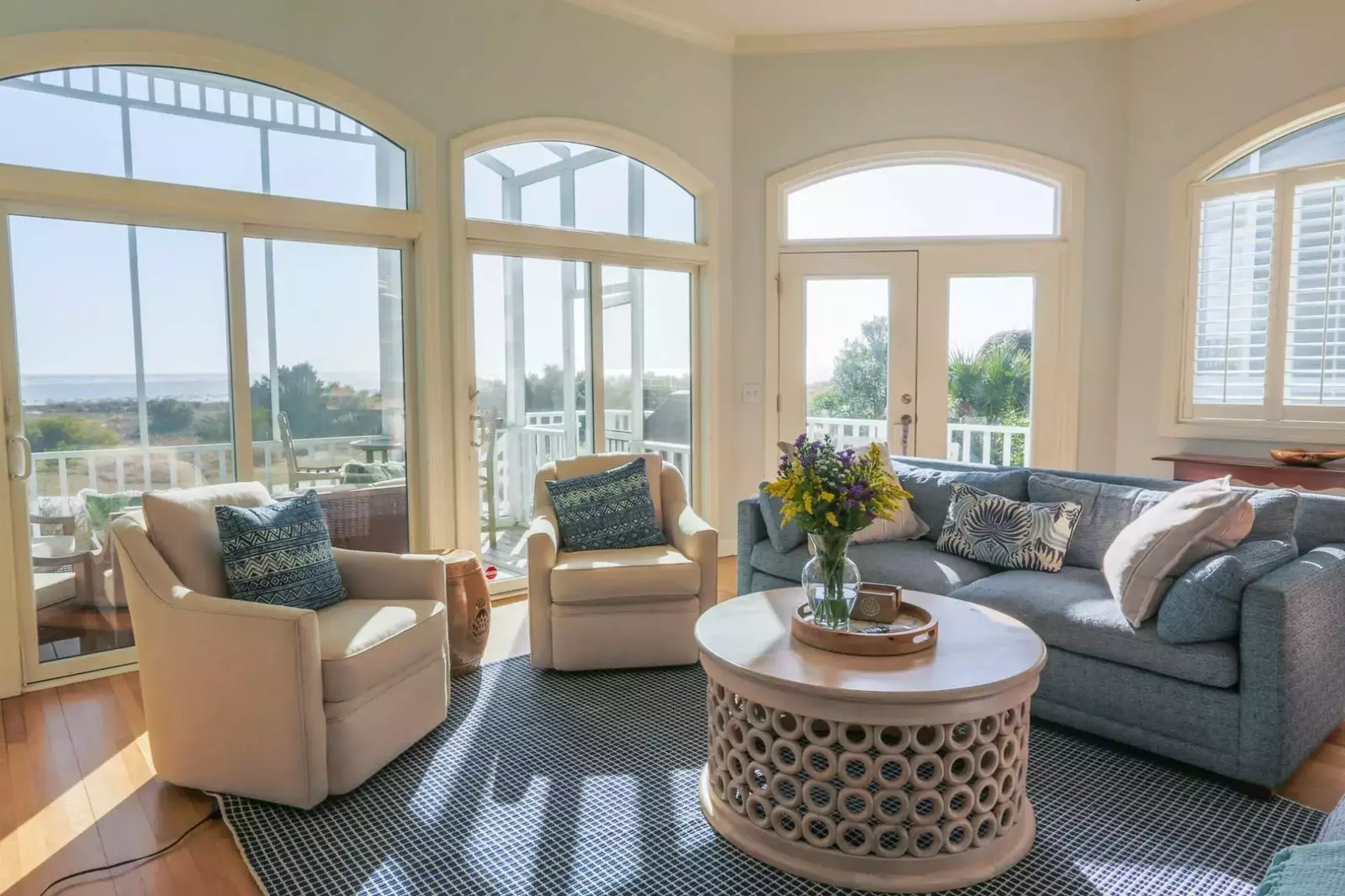 You'll never tire of the views of the ocean and sand dunes from the living room and screened porch.