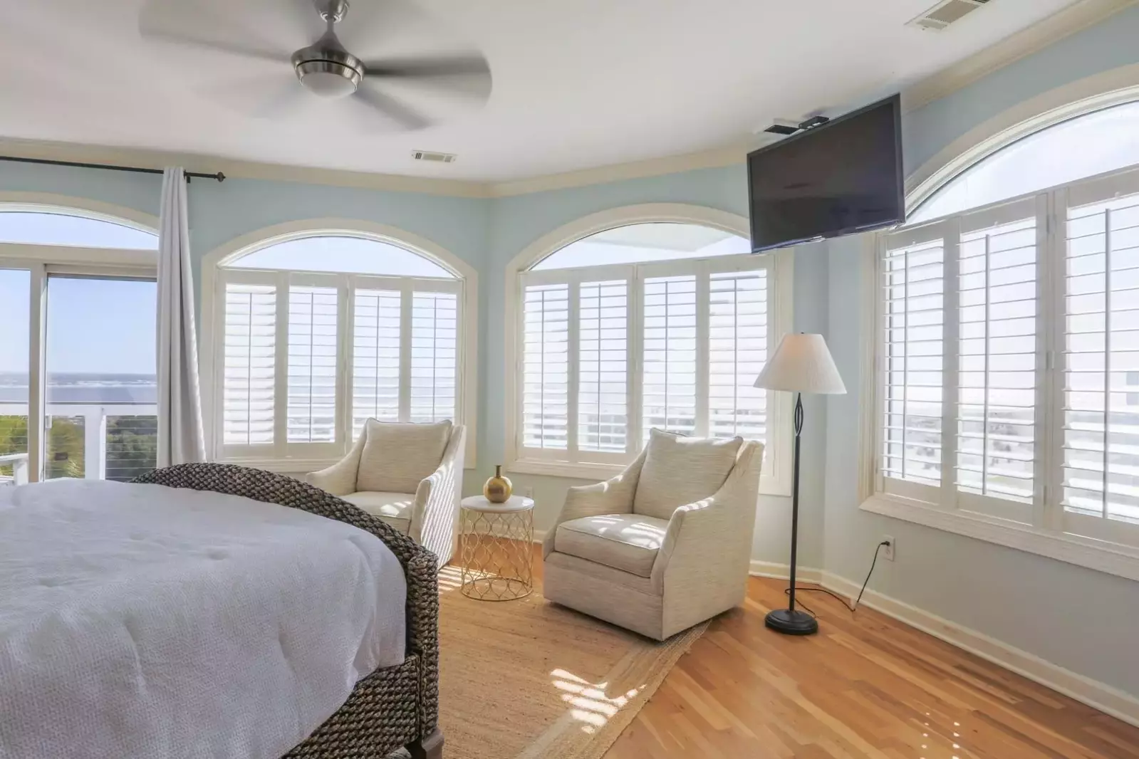 The master bedroom has sliding door access to a balcony.
