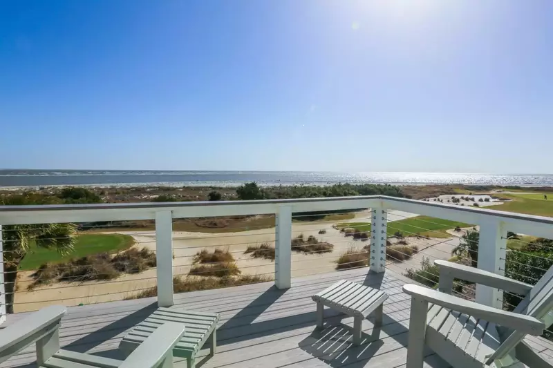 The balcony off of the master bedroom overlooks the ocean, sand dunes and the 18th hole of the Links golf course.